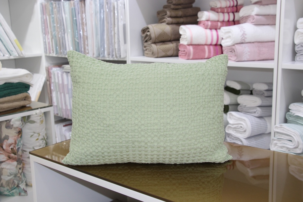 Fronha decorativa verde lima com padrão favo de mel