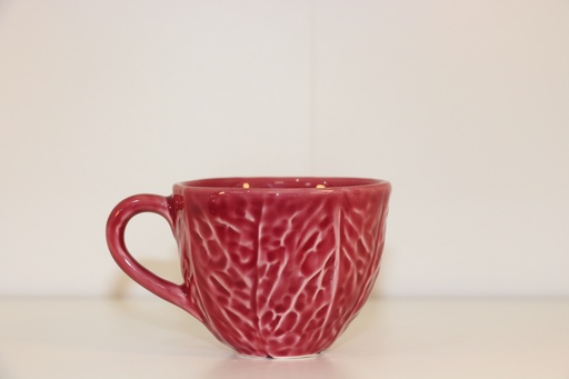 Chávena de cerâmica cor-de-rosa velho com relevo de folha